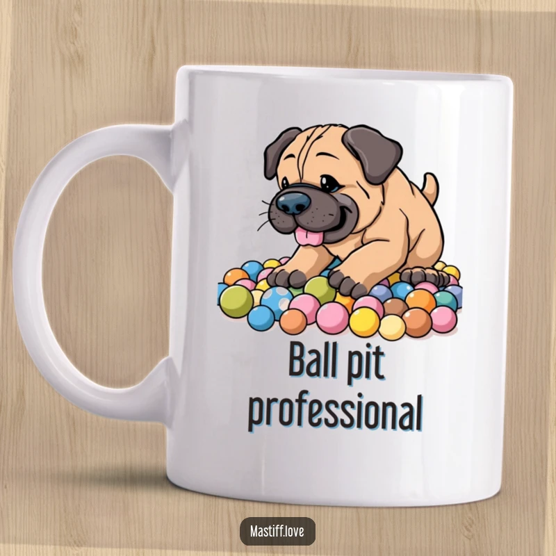 Funny Energetic Mastiff Mug showing a happy dog enthusiastically digging in a pile of colorful balls with a joyful expression.